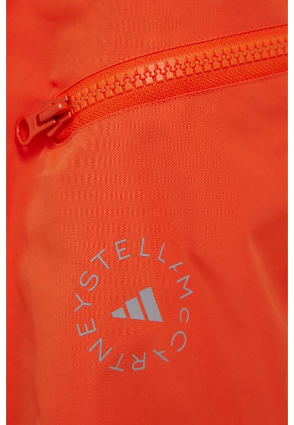 Adidas by Stella McCartney - adidas by Stella McCartney wiatrówka kolor pomarańczowy przejściowa oversize. Typ kołnierza: kołnierzyk stójkowy. Kolor: pomarańczowy. Materiał: materiał, tkanina. Wzór: ze splotem