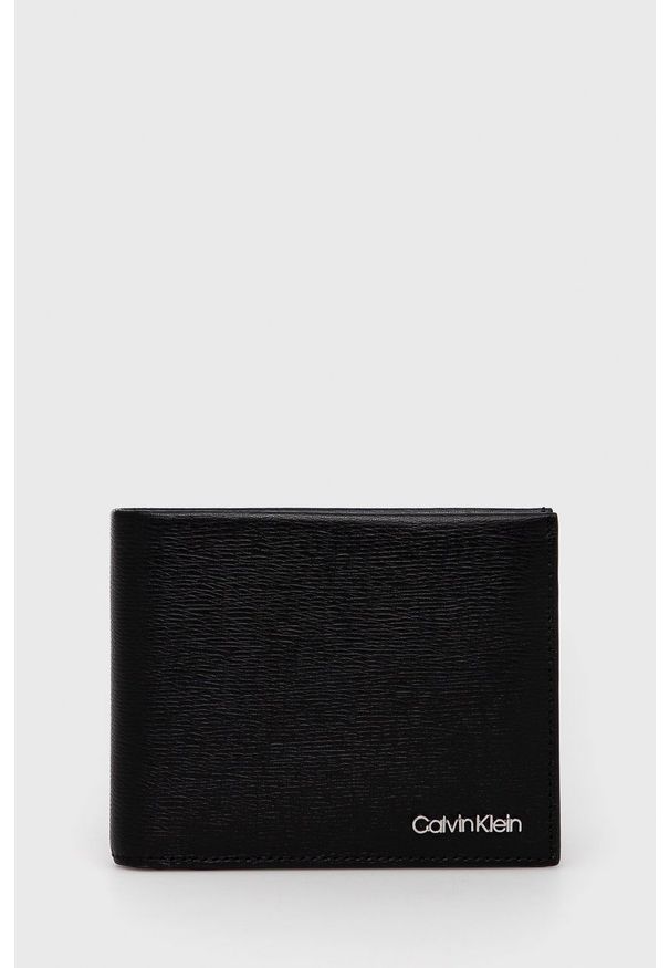Calvin Klein - Portfel skórzany. Kolor: czarny. Materiał: materiał. Wzór: gładki