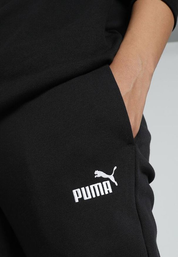 Puma - Damskie spodnie dresowe z małym logo No.1 ESS PUMA Black. Kolor: czarny. Materiał: dresówka
