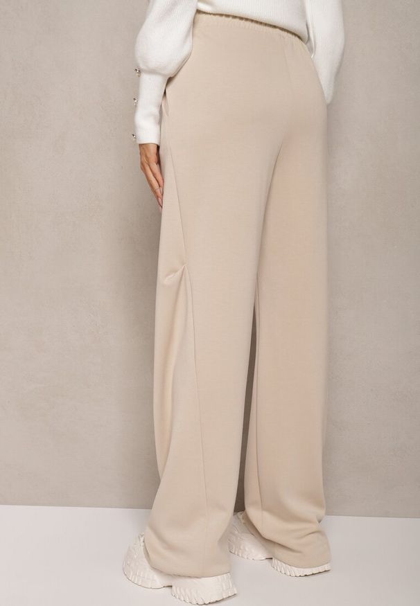 Renee - Beżowe Spodnie o Szerokim Kroju High Waist z Gumką w Pasie Belobira. Okazja: na co dzień. Stan: podwyższony. Kolor: beżowy. Długość: długie. Styl: wizytowy, elegancki, casual