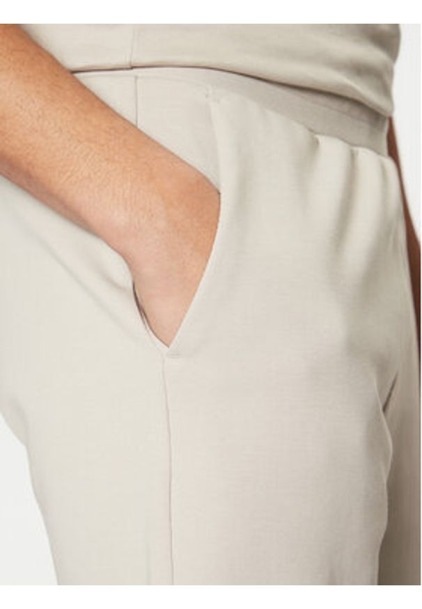 Calvin Klein Szorty sportowe Micro Logo K10K111208 Beżowy Regular Fit. Kolor: beżowy. Materiał: bawełna, syntetyk. Styl: sportowy