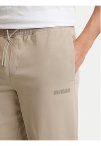 Guess Spodnie dresowe Z6GB01 K2834 Beżowy Regular Fit. Kolor: beżowy. Materiał: bawełna #4