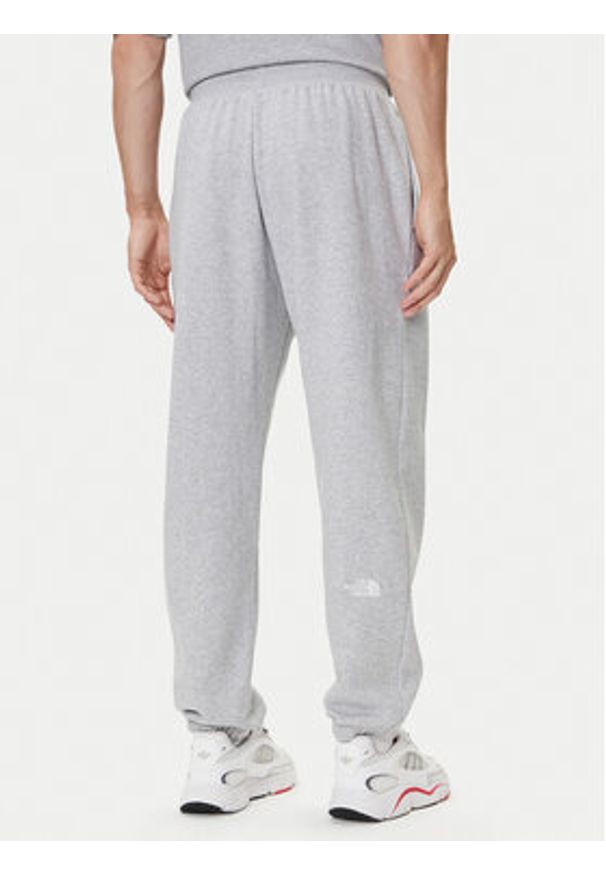 The North Face Spodnie dresowe Essential NF0A8C1F Szary Relaxed Fit. Kolor: szary. Materiał: bawełna
