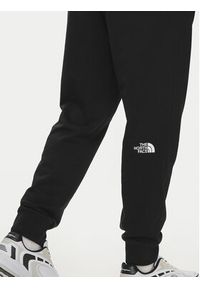 The North Face Spodnie dresowe Nse Light NF0A4T1F Czarny Regular Fit. Kolor: czarny. Materiał: bawełna #5