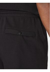 Reebok Spodnie dresowe 100214075 Czarny Regular Fit. Kolor: czarny. Materiał: bawełna #4