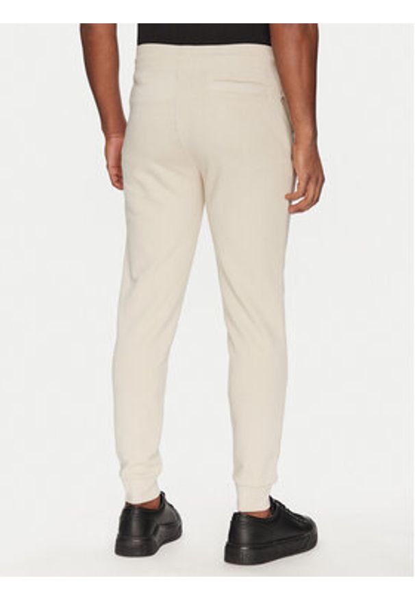 Guess Spodnie dresowe 2YB22 KAIJ1 Écru Regular Fit. Materiał: bawełna