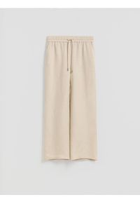 Reserved - Luźne spodnie z lnem - beżowy. Kolor: beżowy. Materiał: len