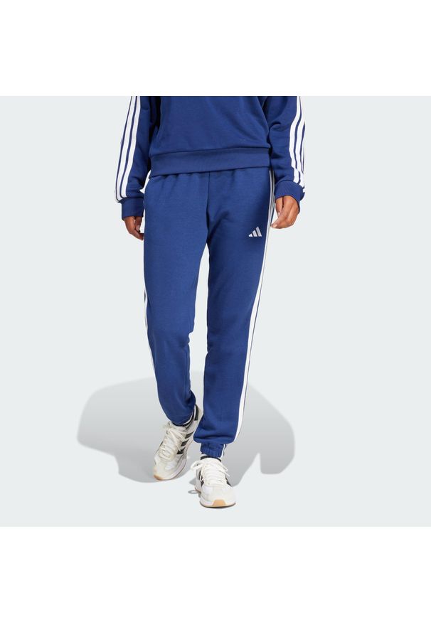 Adidas - Spodnie Essentials 3-Stripes French Terry Cuffed. Kolor: biały, niebieski, wielokolorowy. Materiał: materiał. Sport: fitness