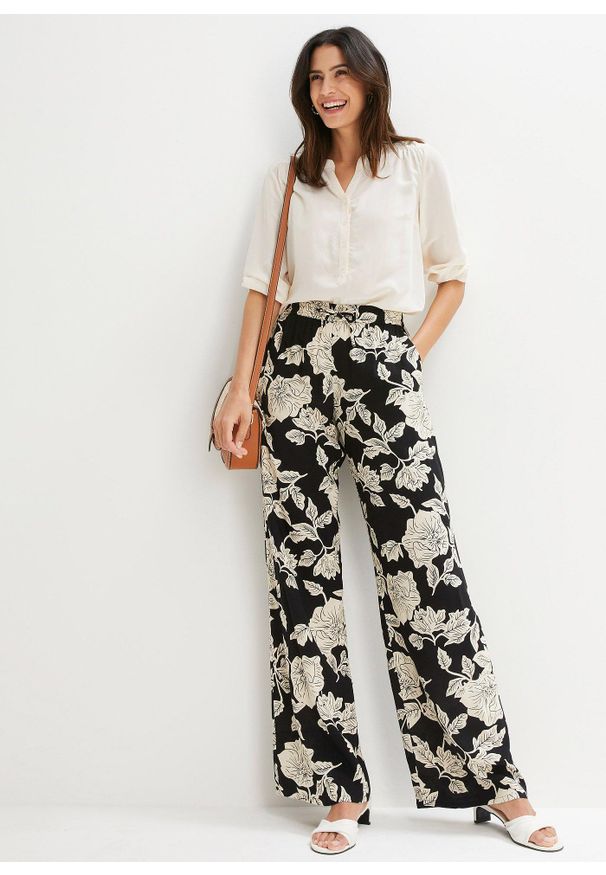 bonprix - Spodnie palazzo z lejącej wiskozy. Kolor: czarny. Materiał: wiskoza. Wzór: nadruk. Styl: elegancki