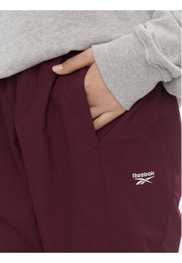 Reebok Spodnie dresowe Classics Franchise IL4627 Bordowy Relaxed Fit. Kolor: czerwony. Materiał: syntetyk