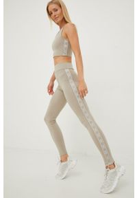 Guess legginsy damskie kolor beżowy z nadrukiem. Stan: podwyższony. Kolor: beżowy. Wzór: nadruk #1