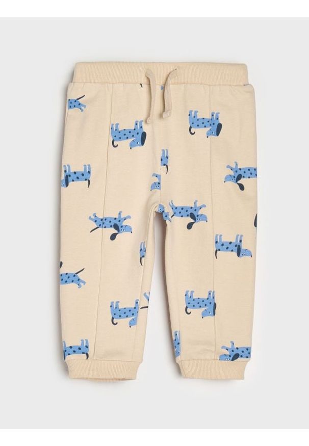 Sinsay - Spodnie jogger ze wzorem - kremowy. Kolor: kremowy