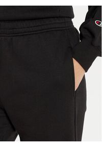 Champion Spodnie dresowe 117583 Czarny Regular Fit. Kolor: czarny. Materiał: bawełna