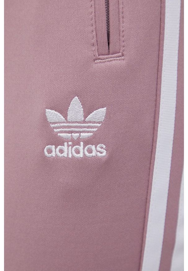 adidas Originals spodnie damskie kolor różowy gładkie. Kolor: różowy. Materiał: materiał, dzianina. Wzór: gładki