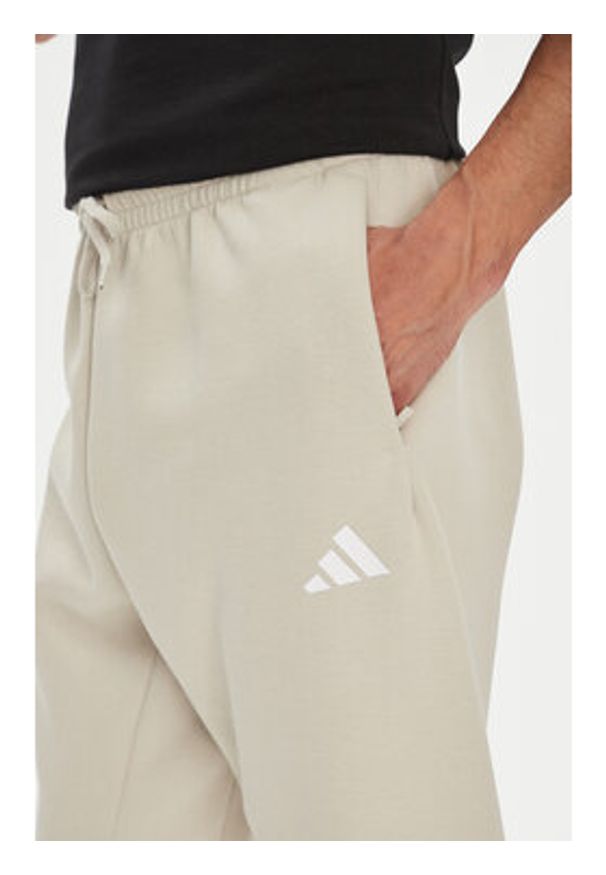 Adidas - adidas Spodnie dresowe Future Icons 3-Stripes JW7092 Beżowy Regular Fit. Kolor: beżowy. Materiał: bawełna