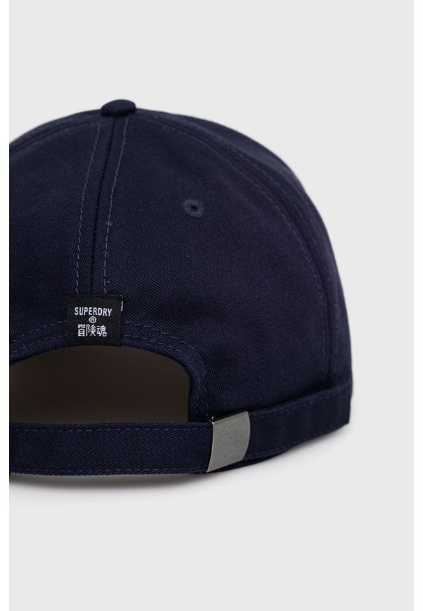 Superdry Czapka kolor granatowy gładka. Kolor: niebieski. Wzór: gładki