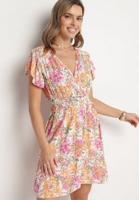 Born2be - Pomarańczowa Bawełniana Sukienka w Kwiaty z Kopertowym Dekoltem Rozkloszowana Jenovienna. Okazja: na co dzień. Typ kołnierza: dekolt kopertowy. Kolor: pomarańczowy. Materiał: bawełna. Wzór: kwiaty. Typ sukienki: kopertowe. Styl: elegancki, casual #3