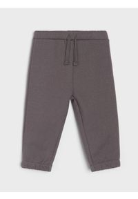 Sinsay - Bawełniane spodnie jogger - brązowy. Kolor: brązowy. Materiał: bawełna