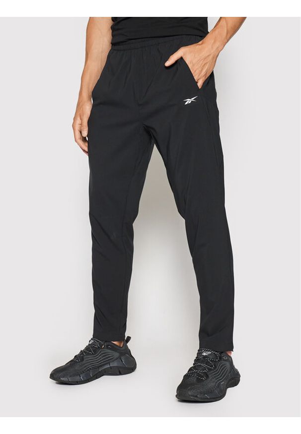 Reebok Spodnie dresowe Workout Ready FJ4060 Czarny Slim Fit. Kolor: czarny. Materiał: syntetyk, dresówka