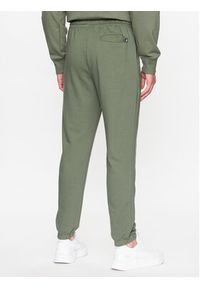 New Balance Spodnie dresowe MP31539 Zielony Regular Fit. Kolor: zielony. Materiał: dresówka, syntetyk, bawełna