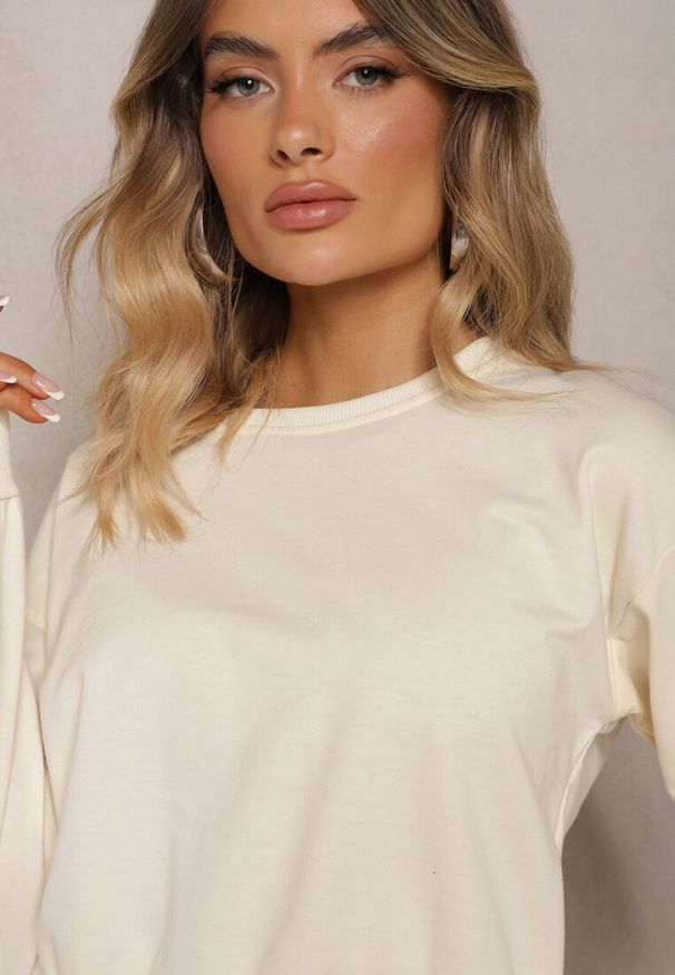 Renee - Jasnobeżowa Bluza z Bawełną ze Ściągaczami przy Rękawach i w Pasie Alberia. Kolor: beżowy. Materiał: bawełna. Długość rękawa: długi rękaw. Długość: długie