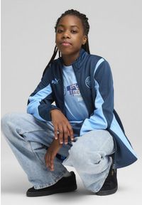 Puma - Młodzieżowa kurtka Manchester City ftblNRGY+ PUMA Marine Blue Blazing. Kolor: niebieski. Wzór: aplikacja