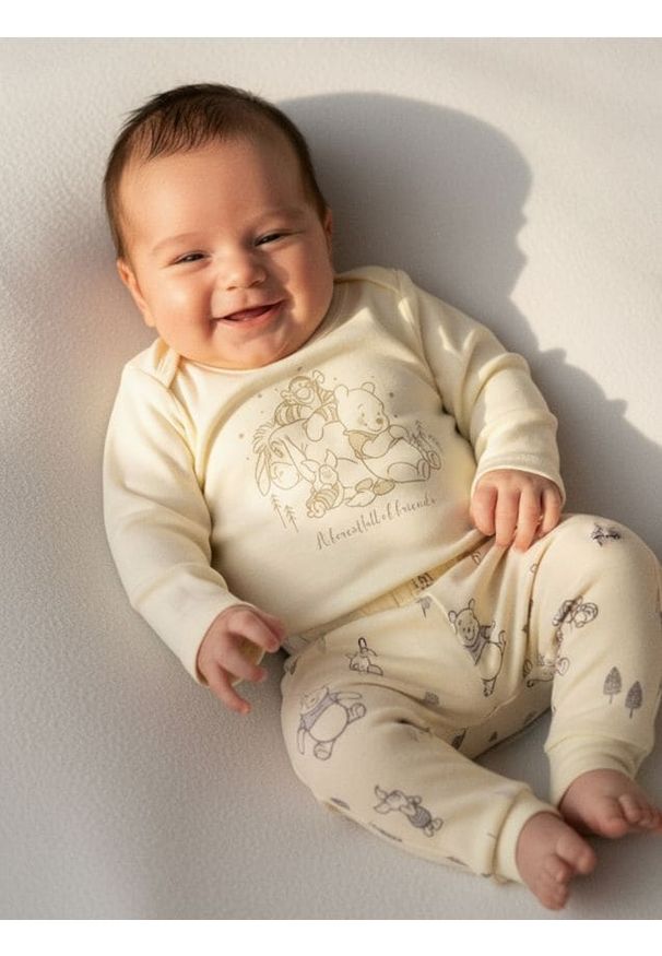 Sinsay - Spodnie z polarem w środku Winnie the Pooh - kremowy. Kolor: kremowy. Materiał: polar