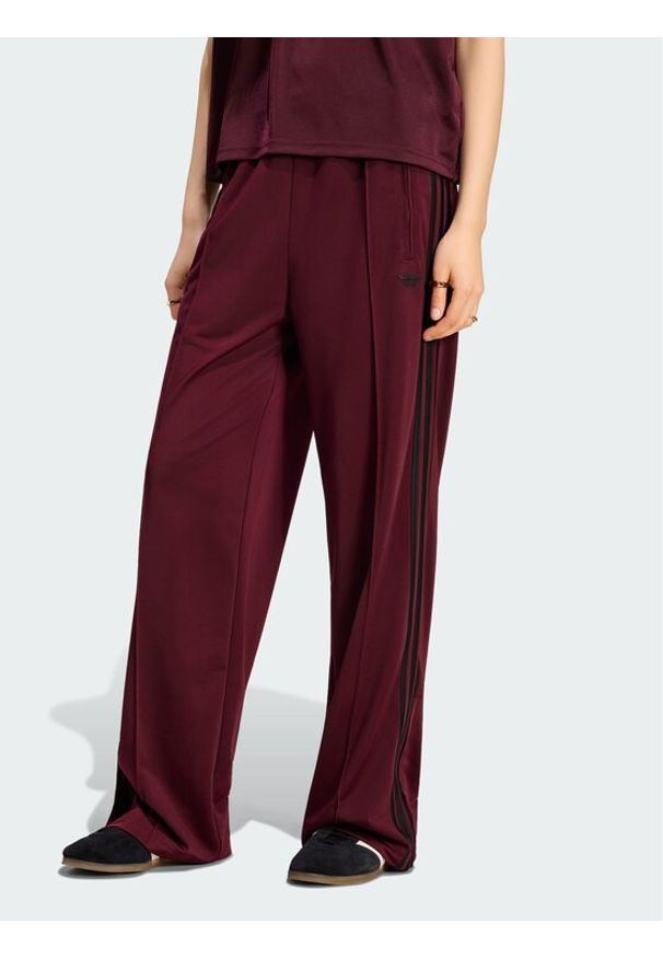 Adidas - adidas Spodnie dresowe Firebird Loose Tracksuit KS4669 Bordowy Loose Fit. Kolor: czerwony. Materiał: syntetyk