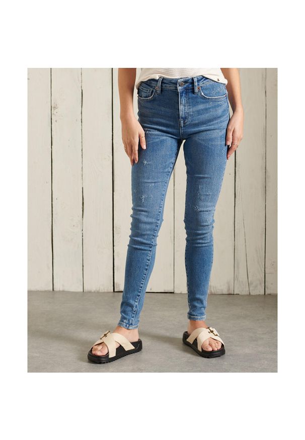 Spodnie turystyczne damskie Superdry High Rise Skinny. Kolor: niebieski. Materiał: elastan, poliester, bawełna. Sport: fitness