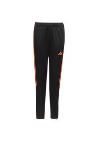 Adidas - Spodnie dla dzieci adidas Tiro 23 Club Training. Kolor: czarny, pomarańczowy, wielokolorowy. Materiał: materiał, dresówka. Sport: joga i pilates, fitness