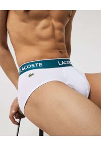 Lacoste - LACOSTE - Zestaw 3 par białych slipów z logo. Kolor: biały. Materiał: bawełna