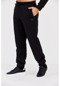 Calvin Klein - CALVIN KLEIN Czarne męskie spodnie dresowe, Rozmiar S. Kolor: czarny. Materiał: dresówka. Wzór: haft #2
