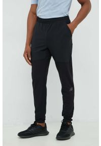 New Balance spodnie treningowe Q Speed męskie kolor czarny. Kolor: czarny. Materiał: materiał #1