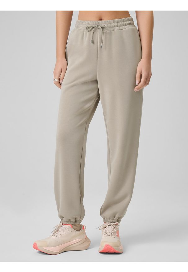 4f - 4F Spodnie z szerokimi nogawkami z modalem damskie - beżowe S. Kolor: beżowy. Materiał: dzianina, materiał, dresówka. Długość: do kostek. Wzór: gładki