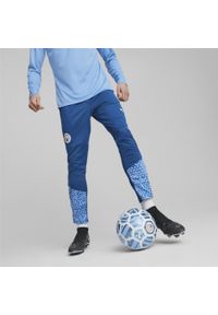 Puma - Spodnie treningowe Manchester City 2023/24. Kolor: niebieski. Sport: piłka nożna