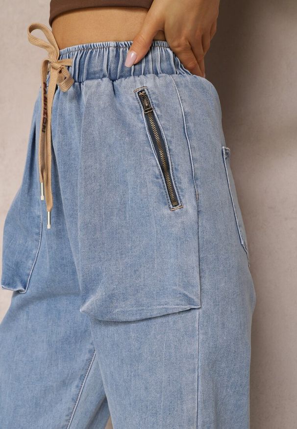 Renee - Niebieskie Jeansy Joggery Zapinane na Suwak ze Ściągaczami i Gumką w Pasie Castania. Okazja: na co dzień. Kolor: niebieski. Styl: elegancki, casual