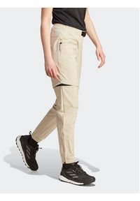 Adidas - adidas Spodnie dresowe Terrex Utilitas Hiking Zip-Off Tracksuit Bottoms HZ9046 Beżowy Regular Fit. Kolor: beżowy. Materiał: syntetyk #10