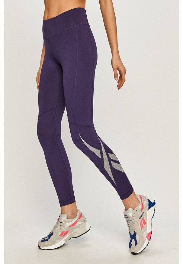 Reebok - Legginsy. Kolor: fioletowy. Materiał: dzianina. Wzór: gładki