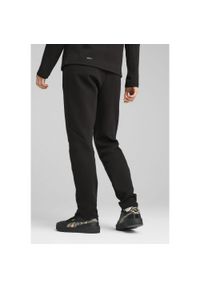 Puma Spodnie Evostripe Dk Op 68505101. Kolor: czarny. Materiał: dresówka
