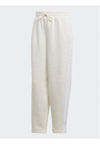Adidas - adidas Spodnie dresowe Essentials 3-Stripes Open Hem Fleece IM0248 Écru Loose Fit. Materiał: bawełna #5