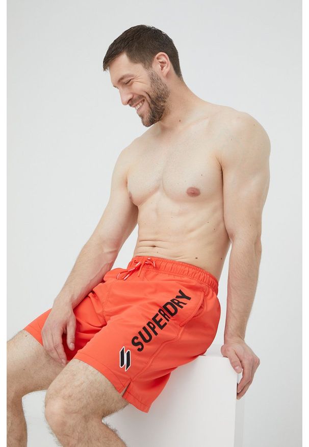 Superdry szorty kąpielowe kolor pomarańczowy. Kolor: pomarańczowy. Materiał: poliester, tkanina. Wzór: aplikacja