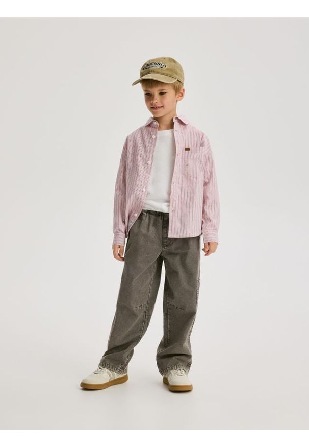 Reserved - Bawełniane spodnie - jasnoszary. Kolor: szary. Materiał: bawełna