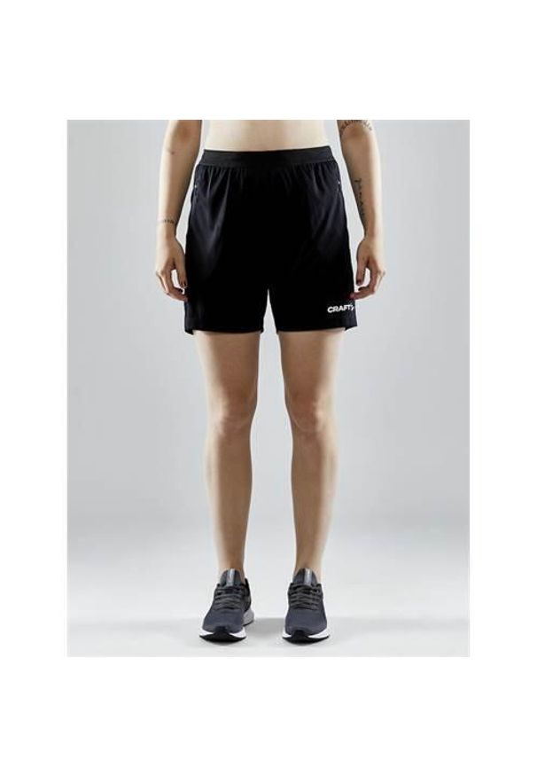 Spodnie treningowe damskie Craft Evolve Zip Pocket. Kolor: czarny. Materiał: syntetyk, materiał. Długość: krótkie. Sport: fitness
