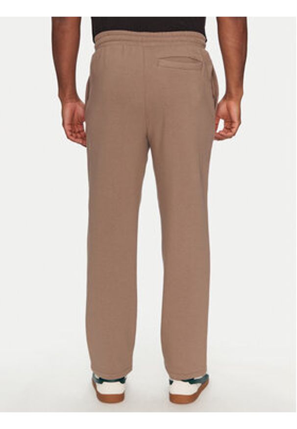 Puma Spodnie dresowe Ess 629651 Brązowy Relaxed Fit. Kolor: brązowy. Materiał: bawełna