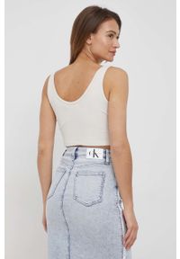 Calvin Klein Jeans top damski kolor beżowy. Kolor: beżowy. Materiał: materiał, lycra. Długość rękawa: na ramiączkach. Wzór: aplikacja