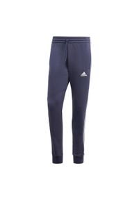 Adidas - Spodnie Essentials Fleece 3-Stripes Tapered Cuff. Kolor: czarny, niebieski. Materiał: polar, materiał