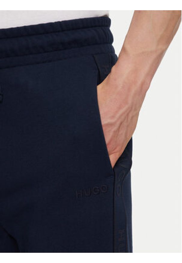 Hugo - HUGO Spodnie dresowe Liam 50540918 Granatowy Regular Fit. Kolor: niebieski. Materiał: bawełna