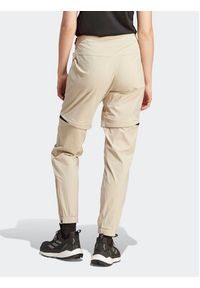 Adidas - adidas Spodnie dresowe Terrex Utilitas Hiking Zip-Off Tracksuit Bottoms HZ9046 Beżowy Regular Fit. Kolor: beżowy. Materiał: syntetyk #9