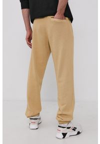 Reebok Classic Spodnie męskie kolor żółty gładkie. Okazja: na co dzień. Kolor: żółty. Materiał: bawełna. Wzór: gładki. Styl: casual #4