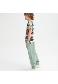 Reserved - Dresowe spodnie z przeszyciami - Turkusowy. Kolor: turkusowy. Materiał: dresówka #1